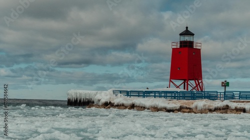Michigan lighthouse in winter. Charlevoix Michigan, Up north lake. Icey wintertime.  photo