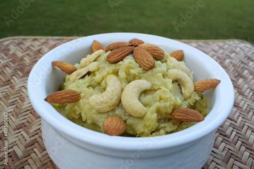 Shakarkandi or Shakarkand a root vegetable sweet dish from Gujarat India home cooked during upawas or vrat ka khana. For mahashivratri, ekadashi garnished with dryfruits decorated. Sweetpotato dessert photo