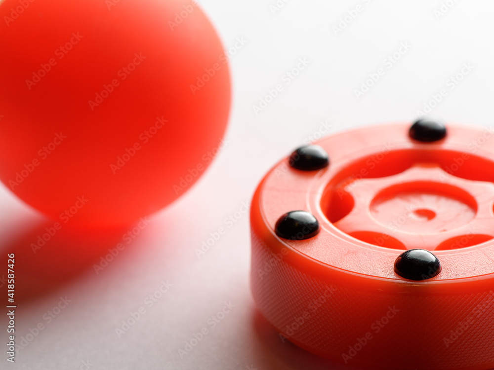 Fototapeta premium Inline hockey puck and ball on white background