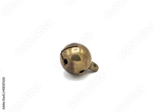 Old golden color sleighbell on white background