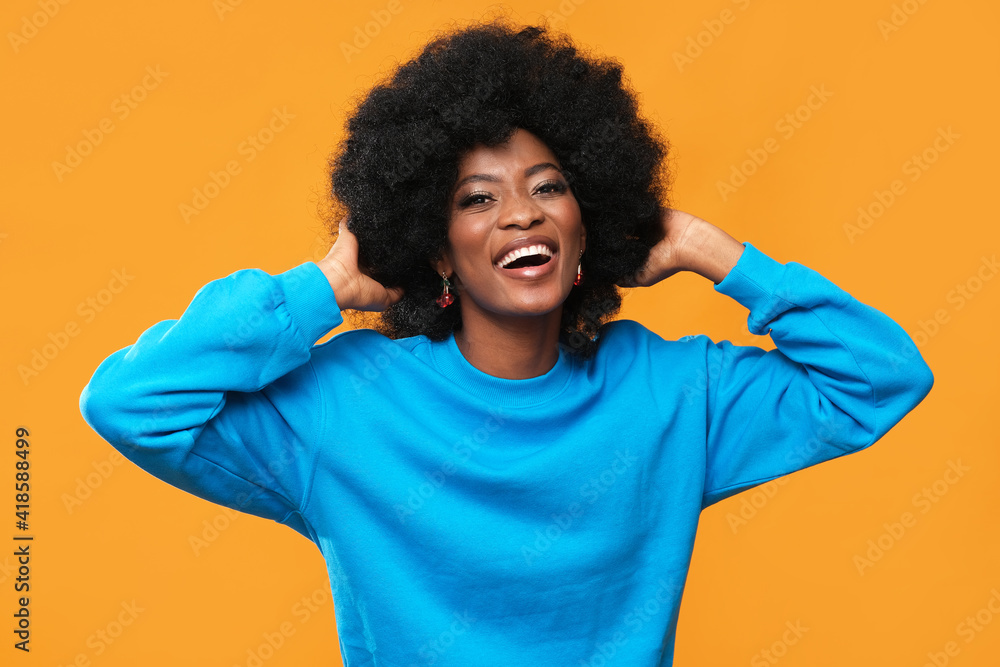 Fashionable black woman on orange background. Fashionable black woman on orange background.
