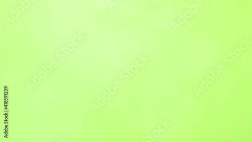 Green ink spreading in water on white. Abstract color background, liquid smoke, psychedelic and art concept. Green screen smoke effect.