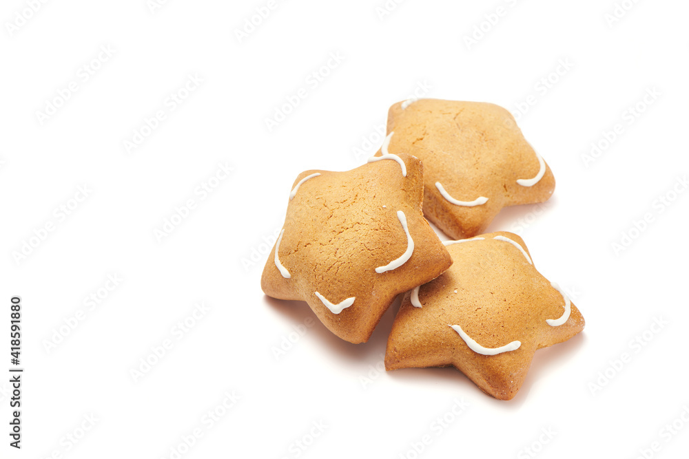 Freshly baked star shaped ginger cookies isolated on white background. Close Up, selective focus view Freshly baked star shaped ginger cookies isolated on white background. Close Up, selective focus view