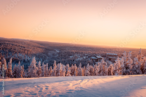 Beautiful winter nature landscape, amazing mountain view of sunset. Scenic image of snowy woodland.