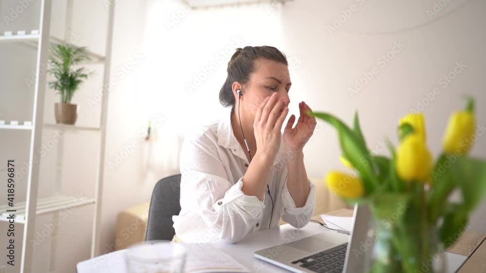 Dissatisfied businesswoman in glasses speaking on video chatting on laptop at home office, freelance work. Angry woman work laptop at home, speak video call at home or office Dissatisfied businesswoman in glasses speaking on video chatting on laptop at home office, freelance work. Angry woman work laptop at home, speak video call at home or office
