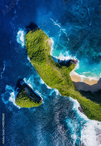 Kelingking beach, Nusa Penida, Indonesia. Aerial view at sea and rocks. Blue ...