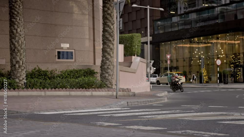 Confident Young Man In Business Clothes Walks Down The Street. He Is Talking On The Phone. Confident Young Man In Business Clothes Walks Down The Street. He Is Talking On The Phone.
