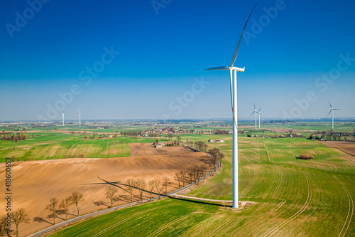Wind turbines on field. Alternative energy in Poland. Aerial view