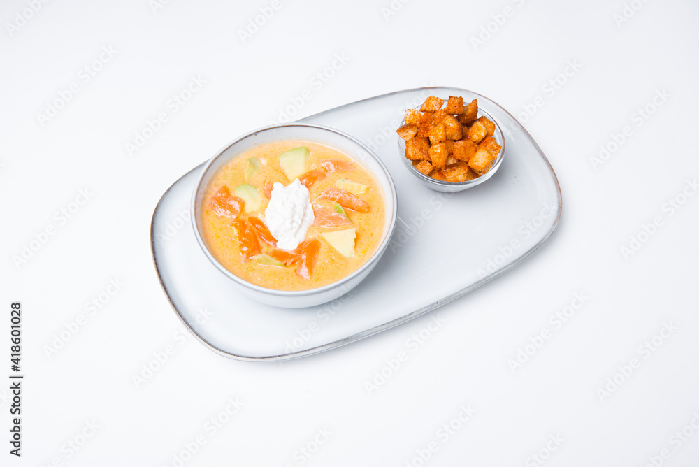 Plate of vegetables soup creme with mozzarella and crackers Plate of vegetables soup creme with mozzarella and crackers