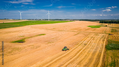 Combine on field with wind ...