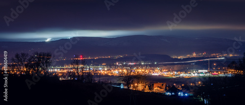Klodzko, night panorama of the city against the background of mountains.