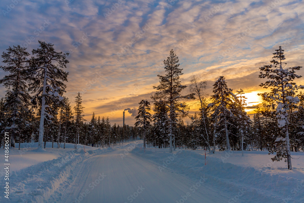 Fototapeta premium Winter landscape at sunset, frozen trees in winter in Lapland, Finland