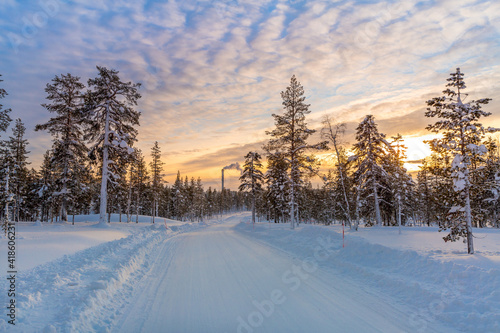 Winter landscape at sunset, frozen trees in winter in Lapland, Finland 