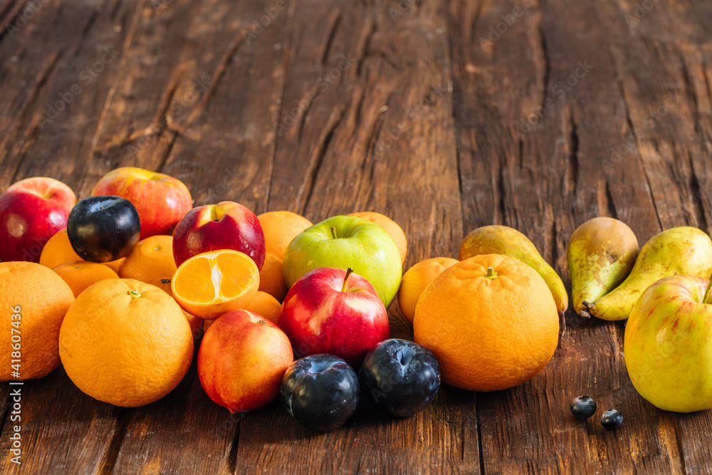 Healthy fruit on a wooden background. the concept of proper nutrition full of vitamin
