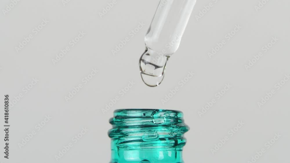 Serum in glass dropper bottle, dish liquid with hyaluronic acid ...