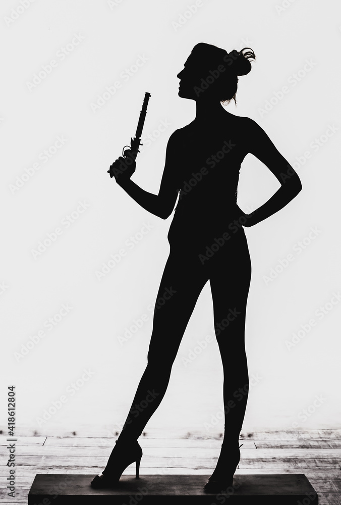 silhouette of a young girl with a flintlock pistol in her hands