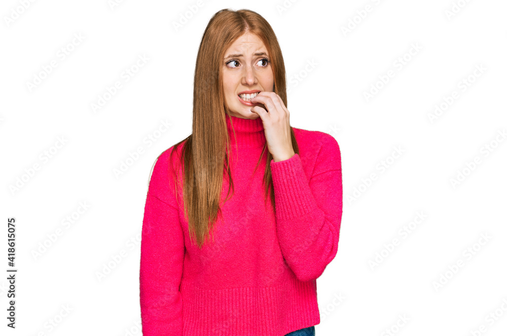 Young irish woman wearing casual clothes looking stressed and nervous with hands on mouth biting nails. anxiety problem.