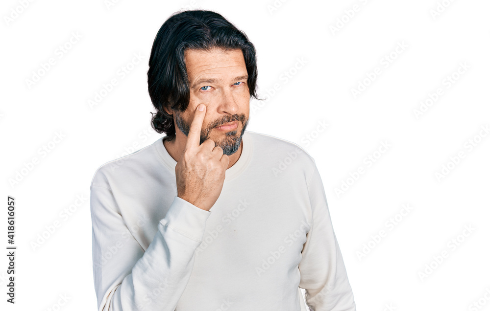 Middle age caucasian man wearing casual clothes pointing to the eye watching you gesture, suspicious expression Middle age caucasian man wearing casual clothes pointing to the eye watching you gesture, suspicious expression