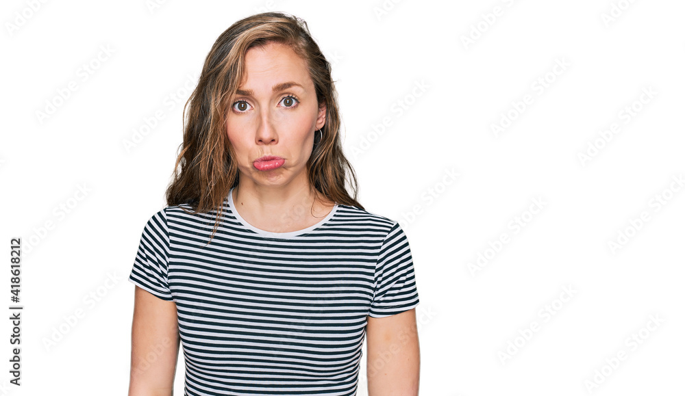 Young blonde woman wearing casual clothes depressed and worry for distress, crying angry and afraid. sad expression. Young blonde woman wearing casual clothes depressed and worry for distress, crying angry and afraid. sad expression.