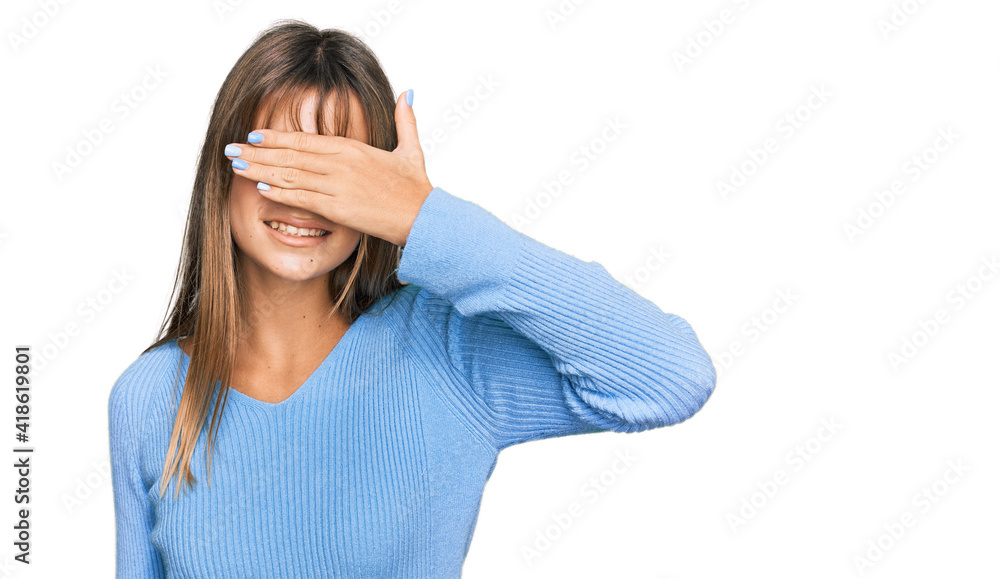 Teenager caucasian girl wearing casual clothes smiling and laughing with hand on face covering eyes for surprise. blind concept. Teenager caucasian girl wearing casual clothes smiling and laughing with hand on face covering eyes for surprise. blind concept.
