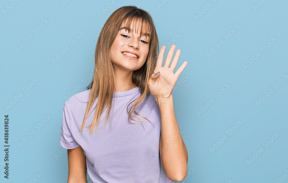 Fototapeta premium Teenager caucasian girl wearing casual clothes showing and pointing up with fingers number four while smiling confident and happy.