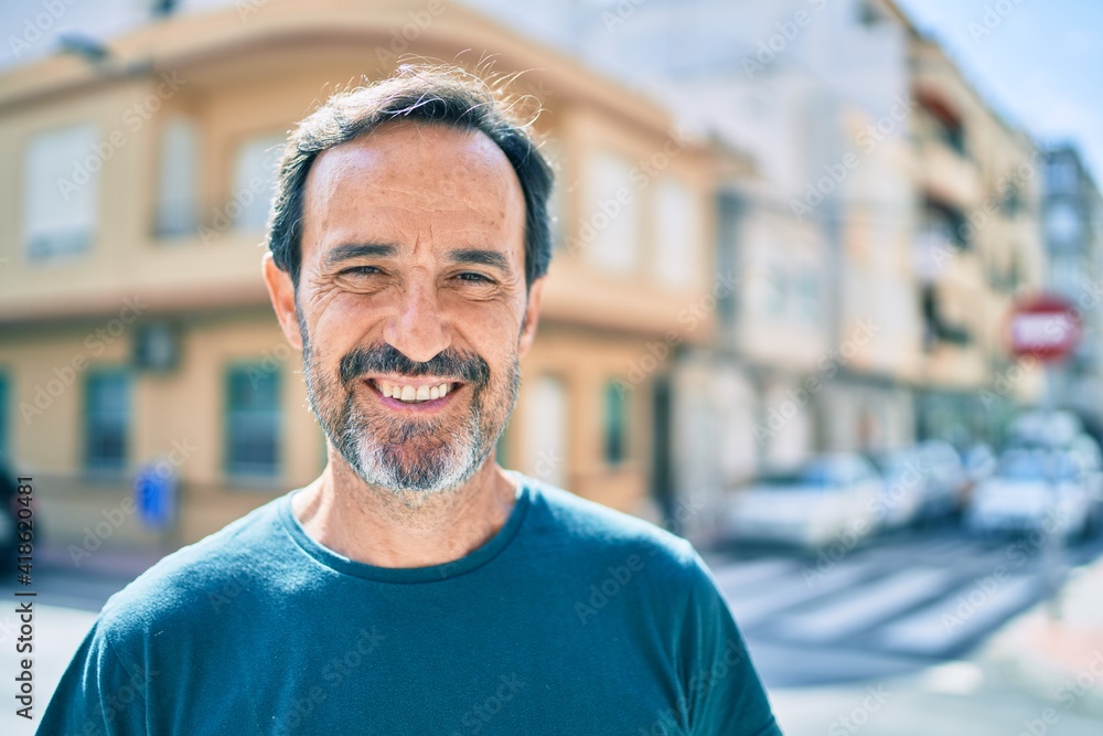 Middle age man with beard smiling happy outdoors