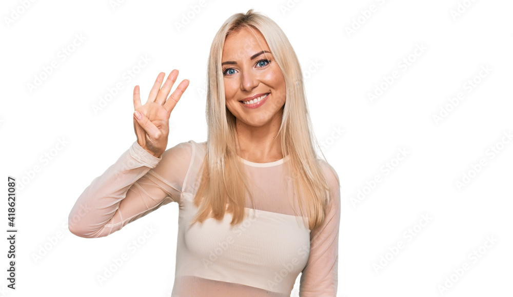 Young blonde woman wearing casual clothes showing and pointing up with fingers number four while smiling confident and happy. Young blonde woman wearing casual clothes showing and pointing up with fingers number four while smiling confident and happy.