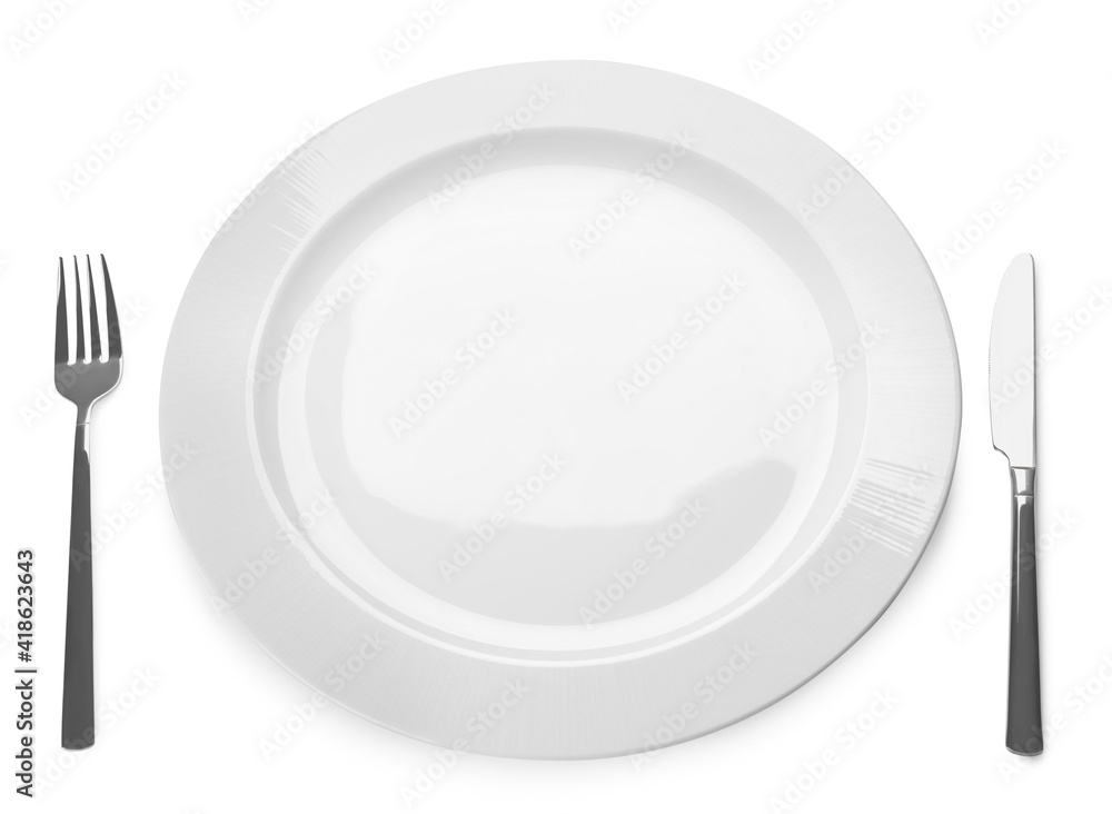 Empty plate and cutlery on white background. Table setting Empty plate and cutlery on white background. Table setting