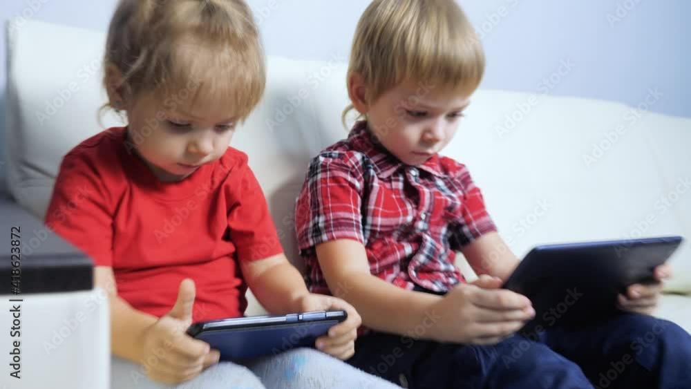 happy family teamwork kids watch online streaming video a on smartphone. little boy and girl brother sister children watch lifestyle online streaming broadcasting cartoons on the phone happy family teamwork kids watch online streaming video a on smartphone. little boy and girl brother sister children watch lifestyle online streaming broadcasting cartoons on the phone