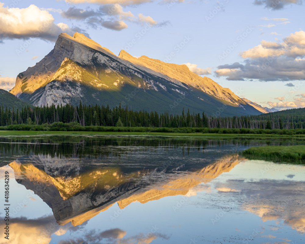 Mountain reflection during a Summer Sunset at Vermillion Lakes in Banff National Park, Alberta, Canada