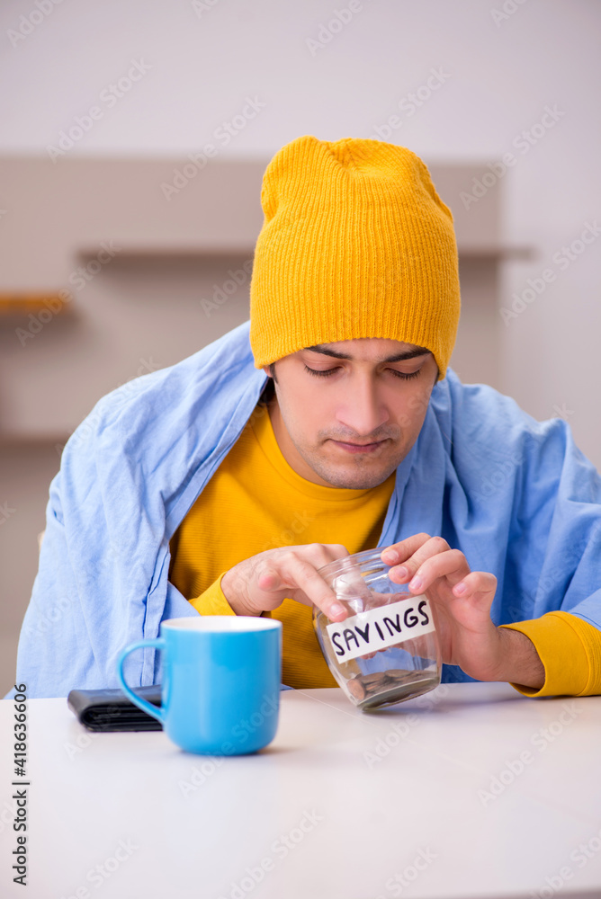 Young man suffering at home in expensive medicine concept Young man suffering at home in expensive medicine concept