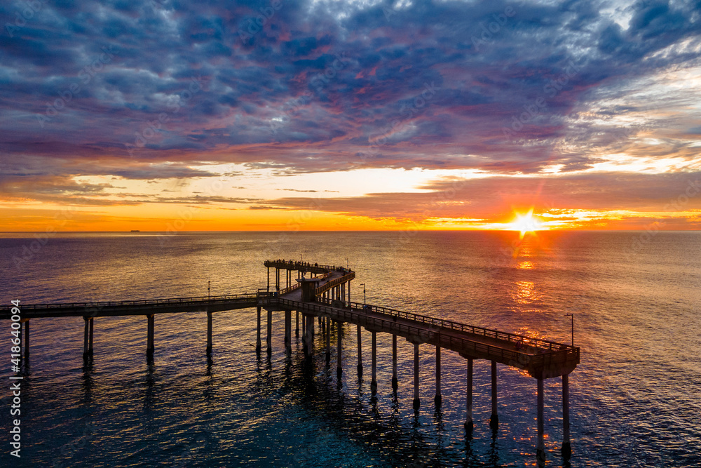 Amazing colorful sunset over the Ocean Beach Fishing Pier