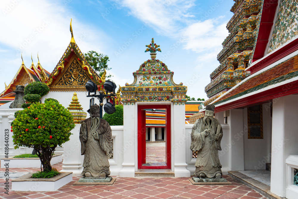 Naklejka premium The Temple of The Reclining Buddha, Bangkok, Thailand under blue sky