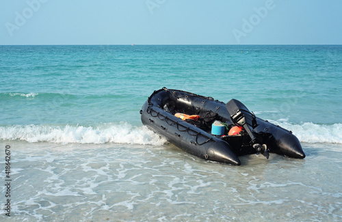 inflatable motor boat on the beach