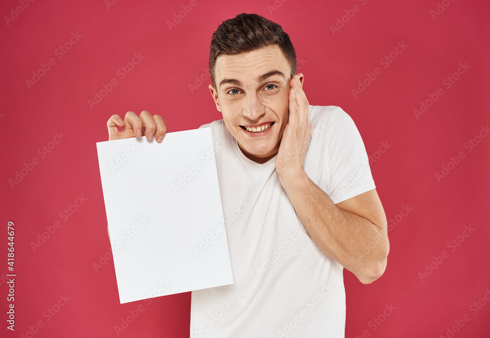 Joyful man on a red background with a white flag in his hand mock up poster Joyful man on a red background with a white flag in his hand mock up poster