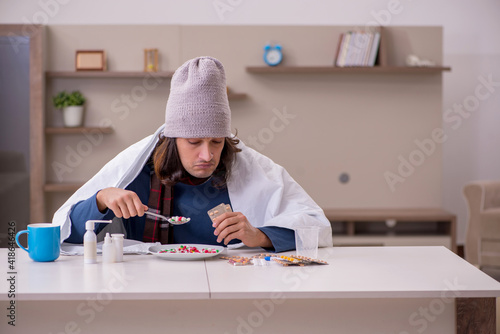 Young man suffering at home