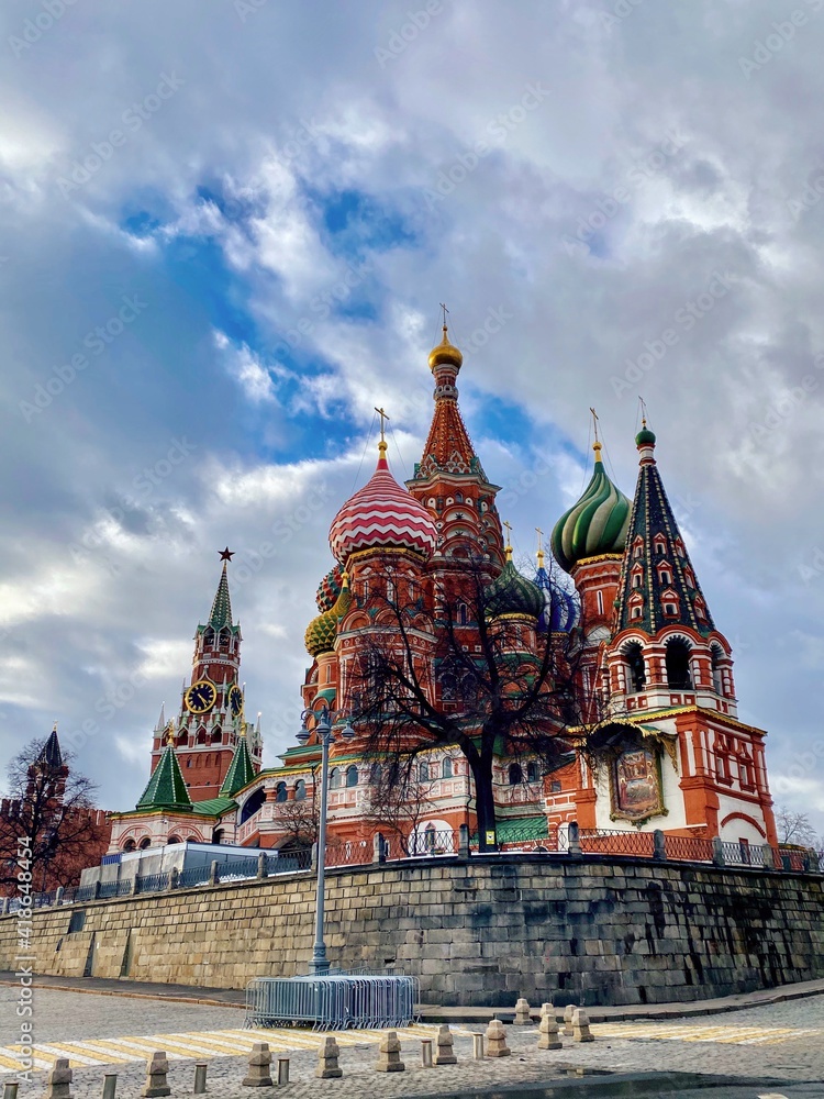 St. Basil's Cathedral and the Spasskaya Tower of the Kremlin on Red Square, Moscow, Russia on in the first days of spring. Sights capital of Russia.