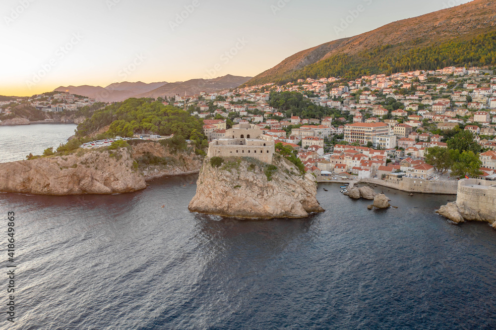 Aerial drone shot of Fort Lovrijenac near West Harbour outside Dubrovnik old town in Croatia summer sunset