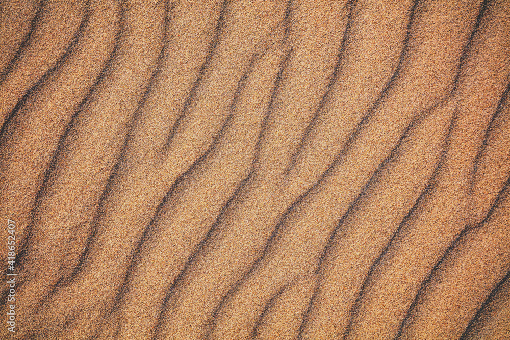 Abstract wavy sandy background. Beach sand texture Abstract wavy sandy background. Beach sand texture