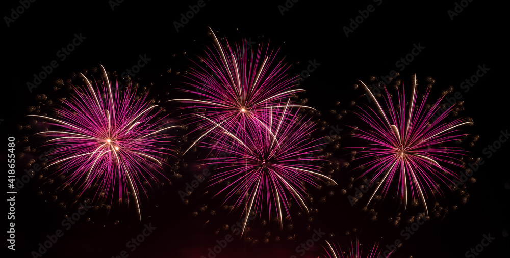 Fireworks with different color and pattern for celebration in various events including new year, party, ceremony, birthday or other show and display on night dark sky background.