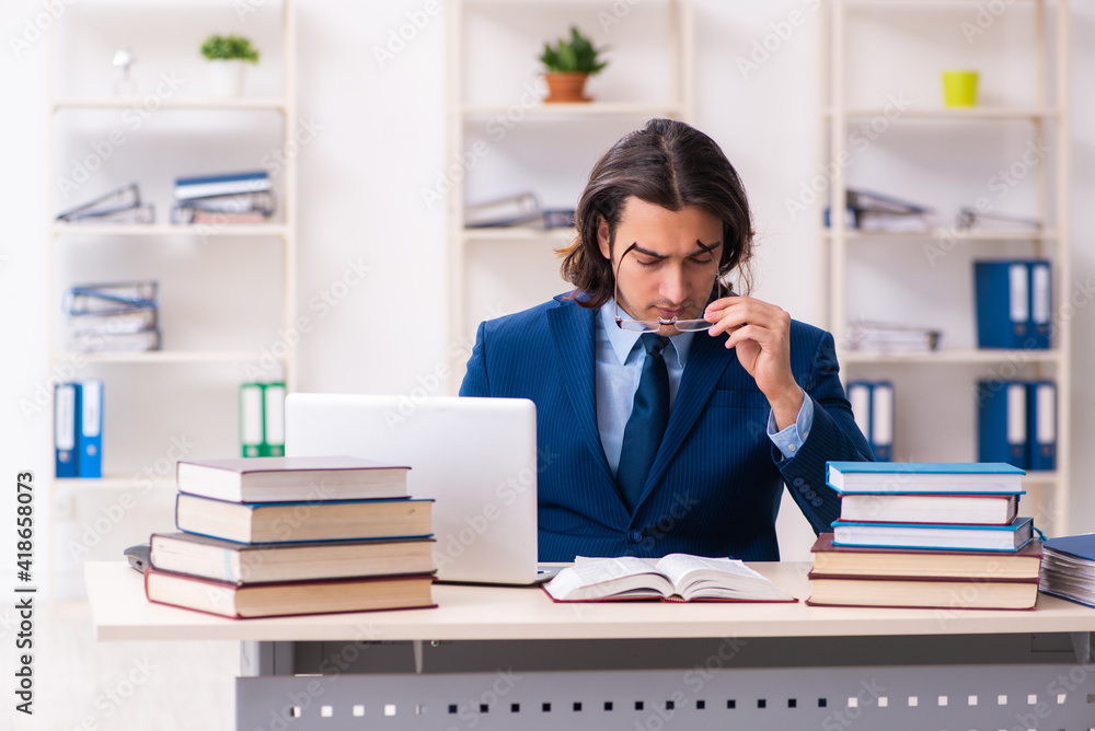 Young businessman student studying at workplace Young businessman student studying at workplace