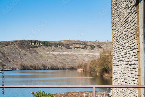 A closeup shot of a river surrounded by industrial lands photo