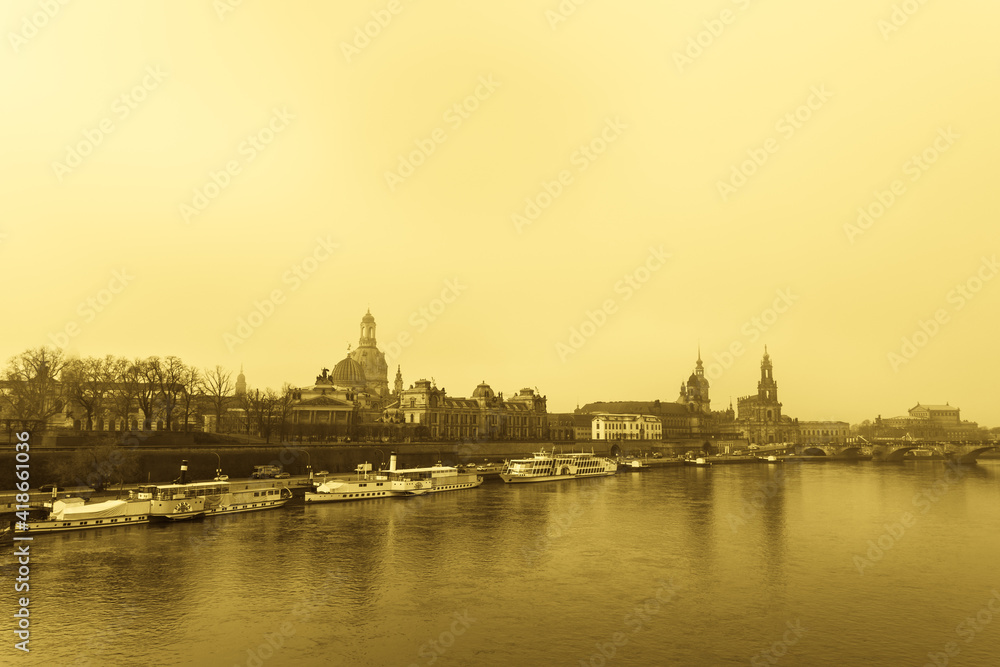 A classical view of Dresden city in sepia tone. Taken early morning in a misty weather, slightly blurry due to fog.