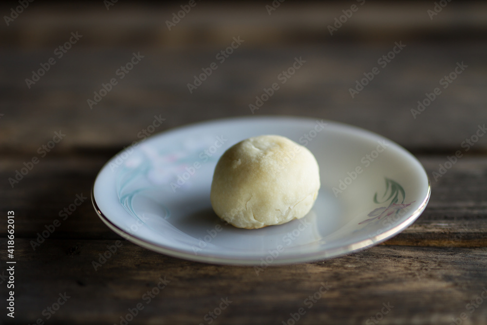 Chainese cake put on white plate on wooden background. Chainese cake put on white plate on wooden background.