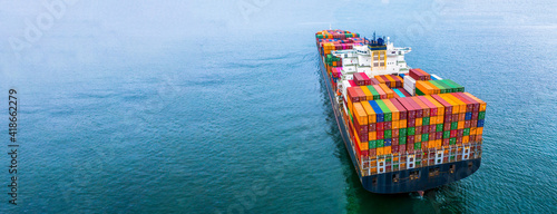 Aerial view container ship carrying container box global business cargo freight shipping commercial trade logistic and transportation oversea worldwide container vessel, Container cargo freight ship. © Kalyakan