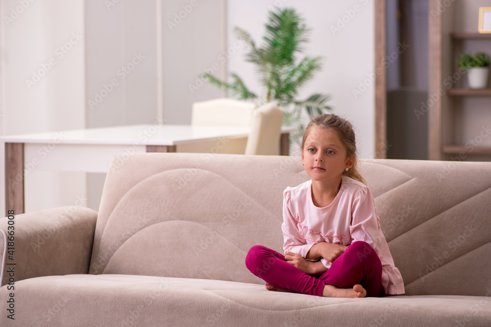 Small girl staying alone at home Small girl staying alone at home