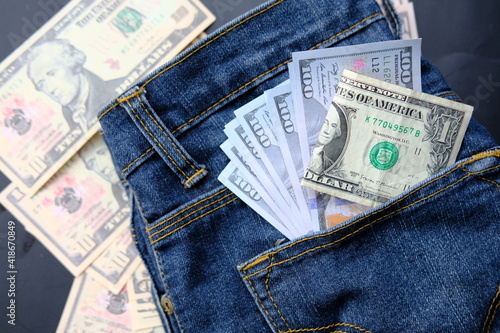 Banknote money in pocket jeans and saving money and business growth concept,finance and investment concept