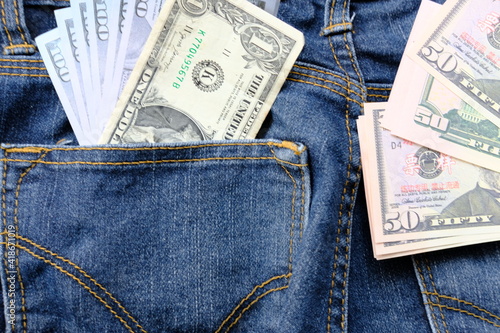 Banknote money in pocket jeans and saving money and business growth concept,finance and investment concept