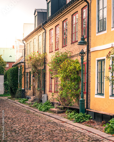Historical town houses on a narrow cobblestoned street in medieval parts of city Lund Sweden © Michael Persson