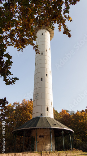 Observation tower on top of Dziewicza Mountain in Zielonka Forest near Poznan Poland. Sunny autumn weather, colorful forest. 